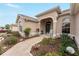 Inviting front porch with rocking chair, landscaping, and walkway at 1397 Oak Forest Dr, The Villages, FL 32162