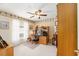 Home office with wooden desk and built-in shelving at 1397 Oak Forest Dr, The Villages, FL 32162