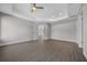 Bright bedroom featuring wood-look floors and a ceiling fan at 14898 Se 35 Ct, Summerfield, FL 34491