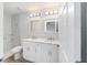 Double vanity bathroom with marble tile and modern fixtures at 15294 Sw 27 Ln, Ocala, FL 34481