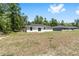 Expansive backyard featuring lush greenery and plenty of room for outdoor activities and entertaining at 15304 Sw 27 Ln, Ocala, FL 34481