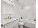 Sparkling new bathroom featuring marble tiling, updated fixtures, and a shower and tub combo at 15304 Sw 27 Ln, Ocala, FL 34481
