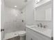 Modern bathroom featuring a walk-in shower with marble tile, a quartz vanity, and modern fixtures at 15304 Sw 27 Ln, Ocala, FL 34481