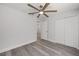 Bedroom featuring a ceiling fan, closet and wood-look flooring for easy maintenance and a modern style at 15304 Sw 27 Ln, Ocala, FL 34481