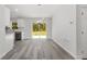 Bright, open kitchen area with stainless steel appliances and sliding glass doors to the backyard at 15304 Sw 27 Ln, Ocala, FL 34481