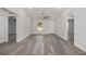 Spacious living room with sleek gray floors, bright white walls, and ample natural light for a modern look at 15304 Sw 27 Ln, Ocala, FL 34481