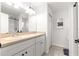 A bright bathroom with a double sink vanity, tiled floors, and a shower-tub combo at 1561 Ne 160Th Pl, Citra, FL 32113