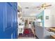 Bright entryway with blue door opening to a view of the living room at 1561 Ne 160Th Pl, Citra, FL 32113