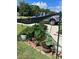 Shade-covered garden with various plants in pots at 1561 Ne 160Th Pl, Citra, FL 32113