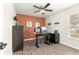 Home office with an adjustable standing desk and ample storage at 1561 Ne 160Th Pl, Citra, FL 32113