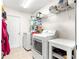 Laundry room with washer, dryer, and overhead storage shelves at 1561 Ne 160Th Pl, Citra, FL 32113