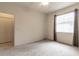 Well-lit bedroom with carpeting and a double door closet at 16205 Sw 12Th Ter, Ocala, FL 34473