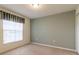 Well-lit bedroom with carpet and window coverings at 16205 Sw 12Th Ter, Ocala, FL 34473