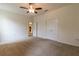 Large bedroom with carpet flooring and access to other rooms at 16205 Sw 12Th Ter, Ocala, FL 34473