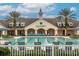 Summerglen community pool with a clubhouse and palm trees at 16205 Sw 12Th Ter, Ocala, FL 34473