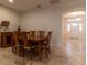 Dining area with wooden table and view to foyer at 16205 Sw 12Th Ter, Ocala, FL 34473