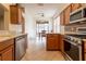 Kitchen with breakfast nook, stainless steel appliances, and wood cabinets at 16205 Sw 12Th Ter, Ocala, FL 34473