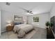 Cozy bedroom features a ceiling fan, neutral walls, soft carpet, and natural light at 17656 Sw 113Th Pl, Dunnellon, FL 34432