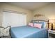 Comfortable bedroom with a queen-size bed and soft decor at 20800 River Dr # A16, Dunnellon, FL 34431