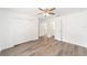 Bedroom featuring a ceiling fan, closet, wood-look floors, and neutral walls at 2270 Sw 141St Ter, Ocala, FL 34481