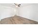 Bedroom featuring wood-look floors, a ceiling fan, and a closet for storage at 2270 Sw 141St Ter, Ocala, FL 34481