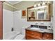 Clean bathroom with a large vanity and white tile at 2418 Ne 7Th St # 10, Ocala, FL 34470