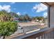 View of tennis courts and parking from condo balcony at 2418 Ne 7Th St # 10, Ocala, FL 34470