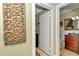 Hallway with access to two bathrooms and decorative wall art at 2418 Ne 7Th St # 10, Ocala, FL 34470