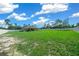 Spacious backyard with grassy area and a white fence at 2701 Sw 175Th Loop, Ocala, FL 34473