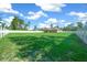 Large grassy backyard with a white fence at 2701 Sw 175Th Loop, Ocala, FL 34473