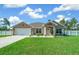 House exterior featuring a neutral color scheme and landscaped yard at 2701 Sw 175Th Loop, Ocala, FL 34473