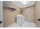 Laundry room with washer, dryer, and shelving for storage at 2701 Sw 175Th Loop, Ocala, FL 34473