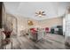 Living room with gray sofas, wood-look floors, and a ceiling fan at 2701 Sw 175Th Loop, Ocala, FL 34473