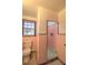 Pink tiled bathroom with shower and toilet at 309 Ne Sanchez Ave, Ocala, FL 34470