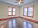 Bright bedroom with hardwood floors and large windows at 309 Ne Sanchez Ave, Ocala, FL 34470