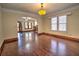 Open dining room with arched entry and hardwood floors at 309 Ne Sanchez Ave, Ocala, FL 34470