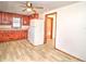 View of kitchen, vinyl flooring, and access to another room at 309 Ne Sanchez Ave, Ocala, FL 34470