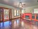 Living room with hardwood floors, built-ins, and fireplace at 309 Ne Sanchez Ave, Ocala, FL 34470