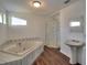 Bathroom includes a soaking tub and walk-in shower at 317 Ne Sanchez Ave, Ocala, FL 34470