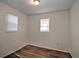 Spacious bedroom with new flooring and window blinds at 317 Ne Sanchez Ave, Ocala, FL 34470