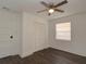 Well-lit bedroom with hardwood floors and a double door closet at 317 Ne Sanchez Ave, Ocala, FL 34470