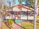 Charming single-story home with a screened porch and brick walkway at 317 Ne Sanchez Ave, Ocala, FL 34470