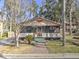 Charming bungalow with a screened porch and brick walkway at 317 Ne Sanchez Ave, Ocala, FL 34470