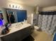 Bathroom with vanity, toilet, shower, and updated finishes at 3396 Parkchester Square Blvd # 103, Orlando, FL 32835