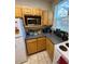 Kitchen corner with microwave, counter space and cabinets at 3396 Parkchester Square Blvd # 103, Orlando, FL 32835