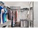 Organized walk-in closet with shelving, hanging rods, and storage for clothes, shoes, and accessories at 5450 Nw 46Th Lane Rd, Ocala, FL 34482