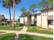 Condo building exterior showcasing a walkway and landscaping at 623 Midway Dr # B, Ocala, FL 34472