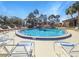 Community pool with plenty of lounge chairs for relaxing at 623 Midway Dr # B, Ocala, FL 34472