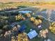 Aerial view of house, barn, and surrounding farmland at 6255 Mercantile Ln, Fort Meade, FL 33841