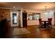 Bright dining room with stone accent wall and wood flooring at 6255 Mercantile Ln, Fort Meade, FL 33841